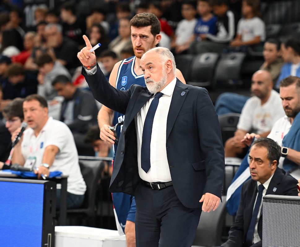 Players from Anadolu Efes and Besiktas compete in match action during the Turkish Basketball Super League derby at Turkcell Basketball Development Centre in Istanbul.